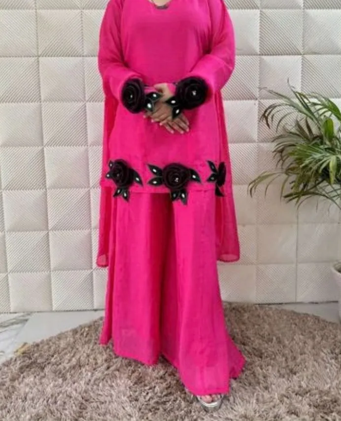 Pink designer sharara suit with black rose appliqué