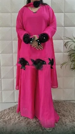 Pink sharara suit with black rose appliqué